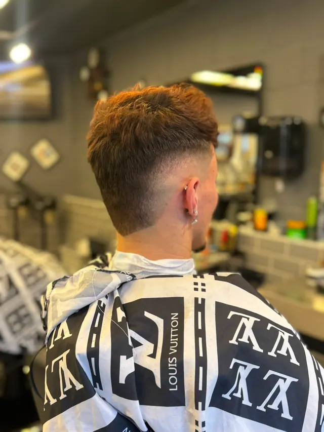 A textured copper-brown crop with a mid fade